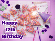 Happy Birthday Age 17 GIF, 17th Birthday GIF: A big paper sparkle highlights this animated birthday gif showing a birthday cake place setting with decorations.