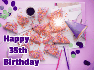 Happy Birthday Age 35 GIF, 35th Birthday GIF: A big paper sparkle highlights this animated birthday gif showing a birthday cake place setting with decorations.