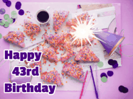 Happy Birthday Age 43 GIF, 43rd Birthday GIF: A big paper sparkle highlights this animated birthday gif showing a birthday cake place setting with decorations.