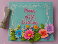 Happy Birthday Age 64 GIF, 64th Birthday GIF: Animated Birthday GIF as a colorful birthday card reading Happy Birthday Name and flower petals floating past.