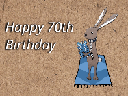 Happy Birthday Age 70 GIF, 70th Birthday GIF: A cute little bunny gif with balloons rising up as it hold a gift box. Text reads Happy Birthday Name. Customize it.