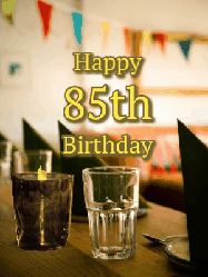 Happy Birthday Age 85 GIF, 85th Birthday GIF: Fancy birthday gif of a bar with a flickering candle, falling confetti, and peronalized text.