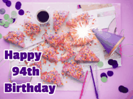 Happy Birthday Age 94 GIF, 94th Birthday GIF: A big paper sparkle highlights this animated birthday gif showing a birthday cake place setting with decorations.