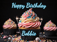 Happy Birthday Bobbie GIF: A delicious cupcake gif with animated sparkles reading Happy Birthday with a name to customize