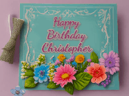 Happy Birthday Christopher GIF: Animated Birthday GIF as a colorful birthday card reading Happy Birthday Name and flower petals floating past.