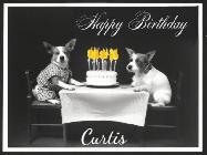 Happy Birthday Curtis GIF: Vintage animated birthday card gif with name, flickering candles, birthday cake, and 2 dogs sitting at the table.