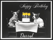 Happy Birthday Darryl GIF: Vintage animated birthday card gif with name, flickering candles, birthday cake, and 2 dogs sitting at the table.