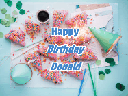 Happy Birthday Donald GIF: Animated birthday gif that can be customized with name showing flowing confetti over a birthday party place setting.
