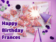 Happy Birthday Frances GIF: A big paper sparkle highlights this animated birthday gif showing a birthday cake place setting with decorations.