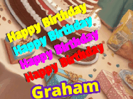 Happy Birthday Graham GIF: Happy birthday animated gif with name to customize depicting 3 star fireworks over a birthday table background.