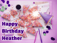 Happy Birthday Heather GIF: A big paper sparkle highlights this animated birthday gif showing a birthday cake place setting with decorations.