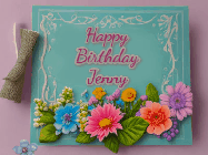 Happy Birthday Jenny GIF: Animated Birthday GIF as a colorful birthday card reading Happy Birthday Name and flower petals floating past.