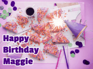 Happy Birthday Maggie GIF: A big paper sparkle highlights this animated birthday gif showing a birthday cake place setting with decorations.