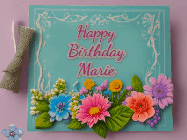 Happy Birthday Marie GIF: Animated Birthday GIF as a colorful birthday card reading Happy Birthday Name and flower petals floating past.