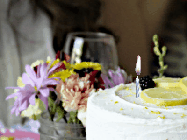 Happy Birthday Melinda GIF: A beautiful and elegant happy birthday animated gif with a cake, flicking candle, animated hearts, and name to customize.