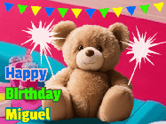 Happy Birthday Miguel GIF: A cute birthday teddy bear animated birthday gif with the bear holding sparklers and text to customize.