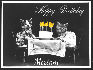 Happy Birthday Miriam GIF: 2 cats sit at a table with a birthday cake with animated candles in this birthday gif you can customize with name.