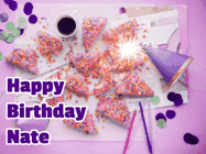 Happy Birthday Nate GIF: A big paper sparkle highlights this animated birthday gif showing a birthday cake place setting with decorations.