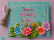 Happy Birthday Sabrina GIF: Animated Birthday GIF as a colorful birthday card reading Happy Birthday Name and flower petals floating past.