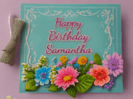 Happy Birthday Samantha GIF: Animated Birthday GIF as a colorful birthday card reading Happy Birthday Name and flower petals floating past.