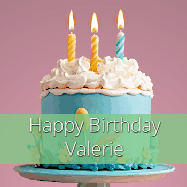 Happy Birthday Valerie GIF: Sparkles fly over a birthday cake that has 3 flickering candles, text in a colored band read Happy Birthday Name.
