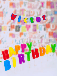 Happy Birthday Victor GIF: Birthday gif animated with a dragon flying over birthday letter candles and lighting them. Customize the name banner.