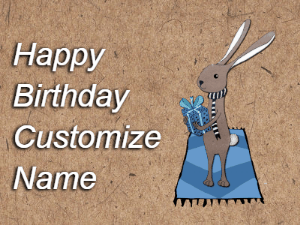 A cute little bunny gif with balloons rising up as it hold a gift box. Text reads Happy Birthday Name. Customize it.